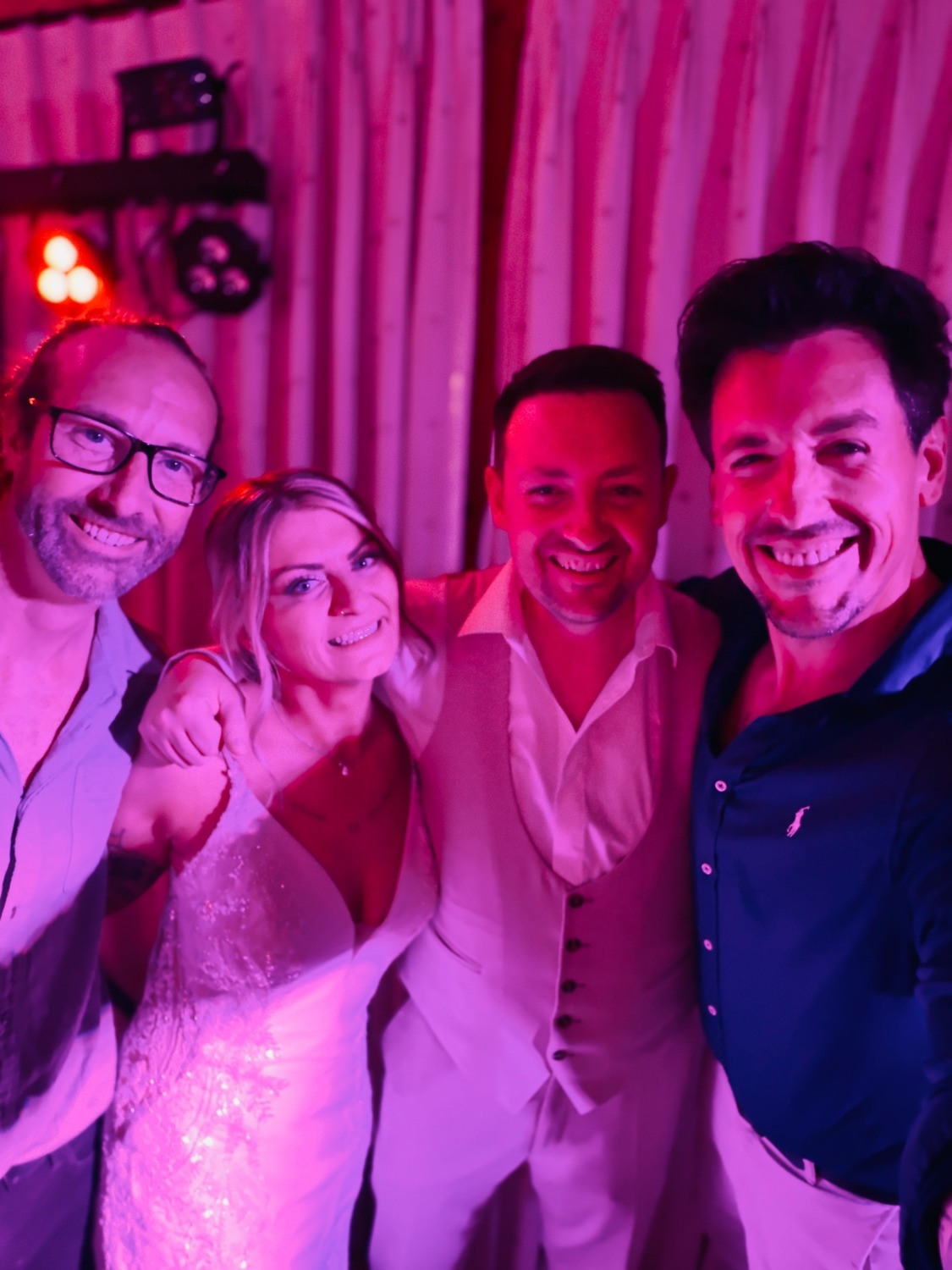 The band with a bride and groom at a wedding